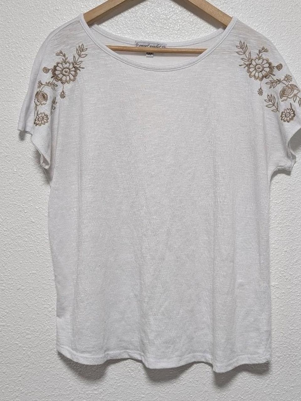 White Top With Embroidered Floral Details